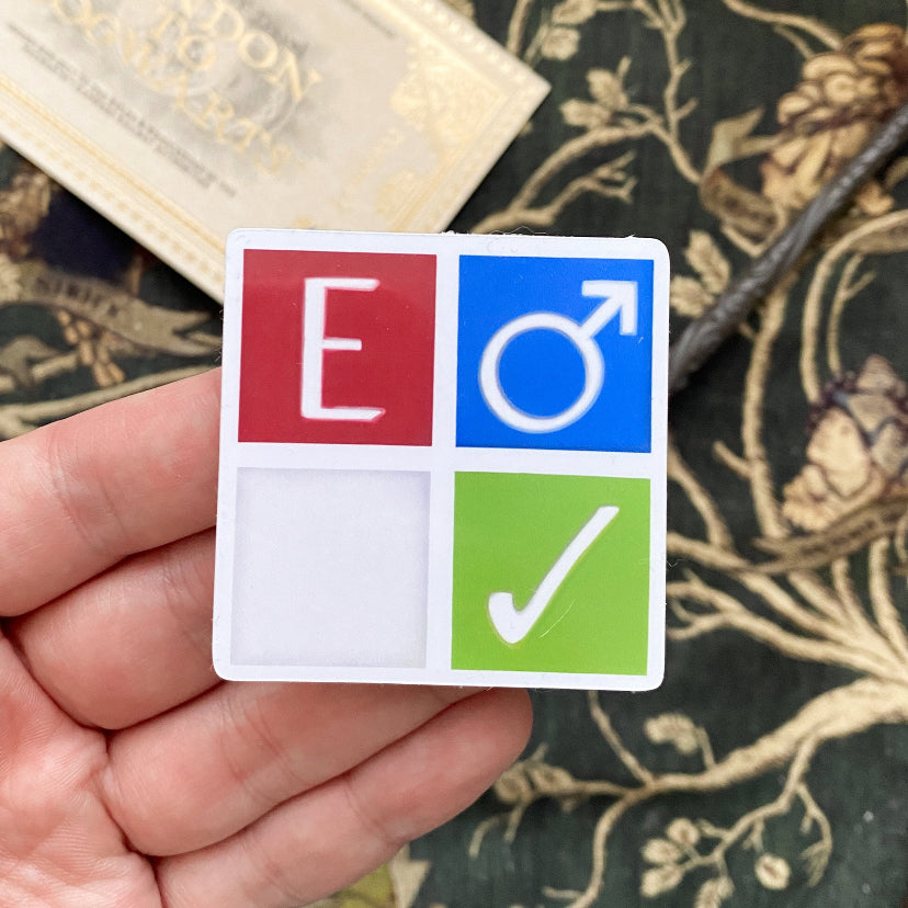 Photo of Archive of Our Own fanfiction symbol sticker. Measuring approximately two by two inches. Rating: E. Category: M/M. Warnings: none. Status: complete.